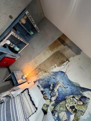 an overhead view of a bedroom with a painting on the floor at Global Home - Aparthotel - No Contact Check In in Mielec