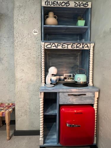 a small table with a red suitcase on a shelf at Global Home - Aparthotel - No Contact Check In in Mielec