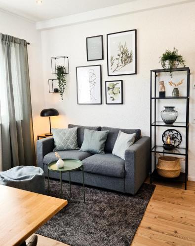a living room with a couch and a table at Mirielle Apartments in Rust