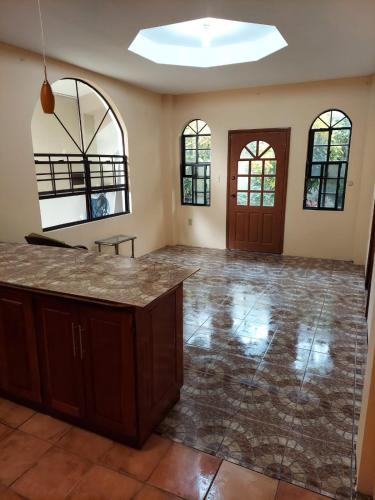 an empty room with a counter in the middle at CASTLE VIEW VILLA in Diamond