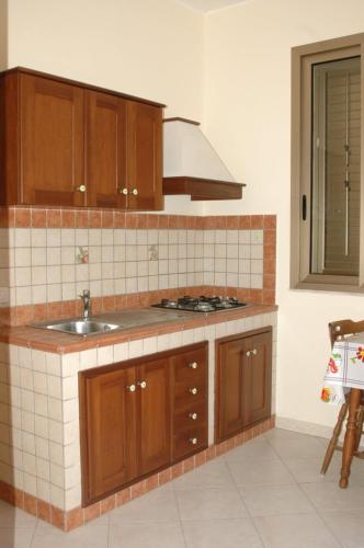 A kitchen or kitchenette at Appartamenti del Nostromo