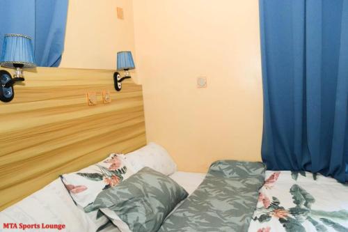 Postel nebo postele na pokoji v ubytování MTA Lounge and Leisures
