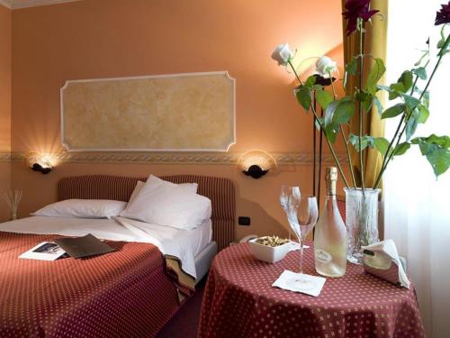 Postel nebo postele na pokoji v ubytování Hotel Bifi