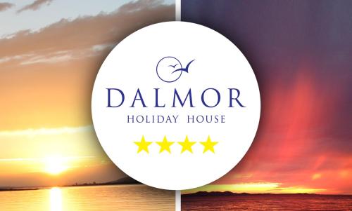 a sign for a holiday house with the sunset in the background at Dalmor holiday house in Rovanjska