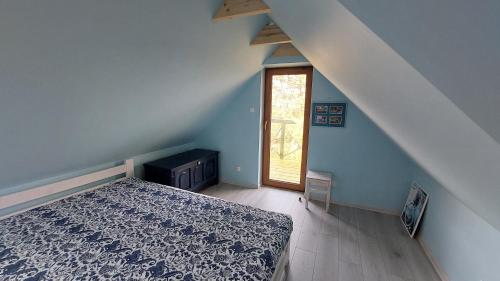 Ένα ή περισσότερα κρεβάτια σε δωμάτιο στο Kaszubskie Marzenie