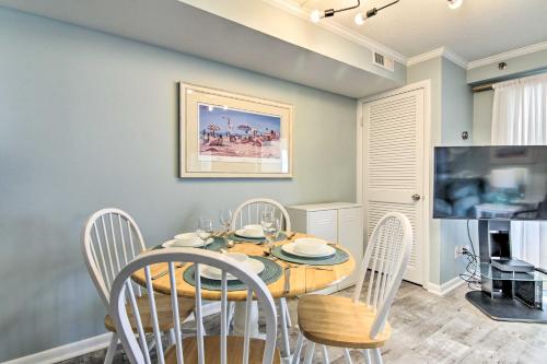 a dining room with a table and chairs at Walk to Ocean City Boardwalk Waterfront Condo in Ocean City