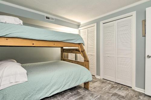 a bedroom with two bunk beds and a closet at Walk to Ocean City Boardwalk Waterfront Condo in Ocean City