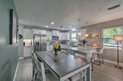 a kitchen with a large wooden table in a room at Bright Venice Getaway Less Than 1 Mi to Historic Dtwn in Venice
