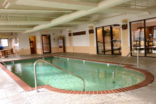 a large swimming pool in a building at La Quinta by Wyndham Springfield South in Springfield