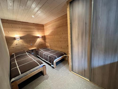 Katil atau katil-katil dalam bilik di Gentianes 1 - Très bel appartement centre village et proche des pistes