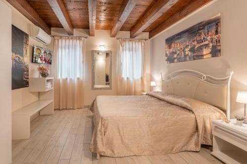 Posteľ alebo postele v izbe v ubytovaní Piccola Venezia Room