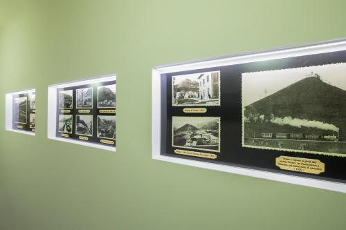 a group of pictures on a wall in a museum at B&B Del Centro in Clusone
