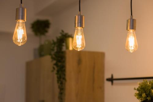 a group of lights hanging in a room at Aju Hillel 14 in Jerusalem