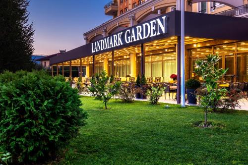 a restaurant with a sign that reads lunch garden at Landmark Creek Hotel & Wellness in Plovdiv