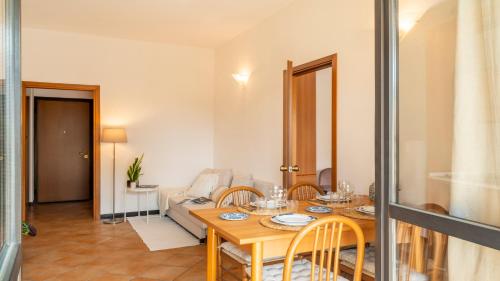 a living room with a table and a couch at Lagoon in Sirmione