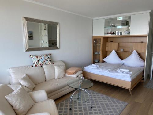 Postel nebo postele na pokoji v ubytování Top - Seaside Appartement mit Meerblick