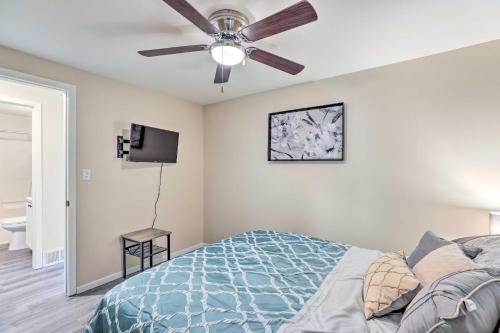 a bedroom with a ceiling fan and a bed at Renovated Home with Deck, Steps to State Park! in Ottawa