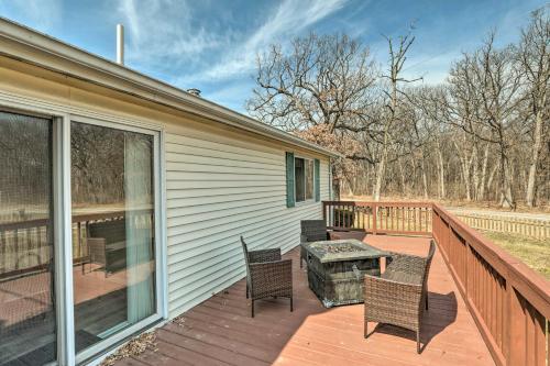 a patio with chairs and a table on a deck at Renovated Home with Deck, Steps to State Park! in Ottawa