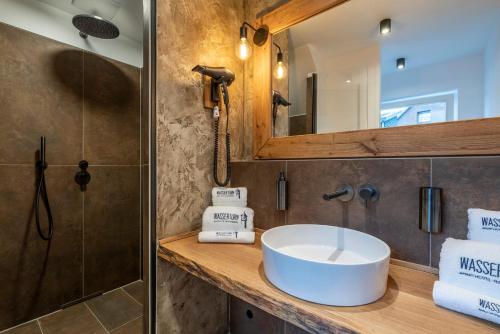 a bathroom with a sink and a shower at Apartment Suite - a57366 in Bad Segeberg