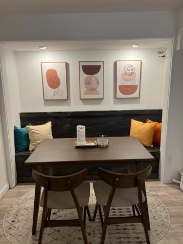 a dining room with a table and two chairs at The Brooks Hotel Restaurant and Lounge in Wallace