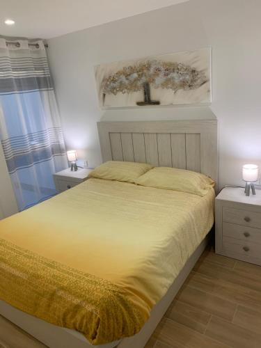 Postel nebo postele na pokoji v ubytování Acogedora Casa con Patio en El Tiemblo (Ávila)