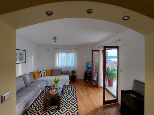 a living room with a couch and a table at Apartments Gracia & Toni in Trogir