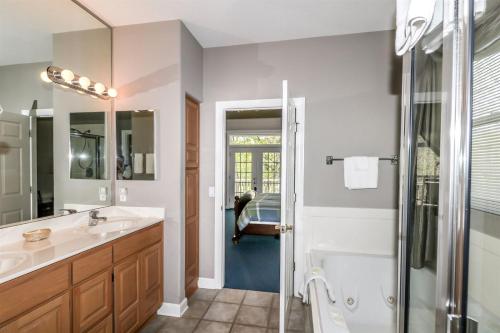 a bathroom with a shower and a sink at 18814 - 14 Juego Way in Hot Springs Village