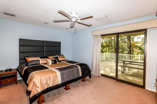 a bedroom with a bed and a ceiling fan at 05244 - 44 Pego Circle in Hot Springs Village