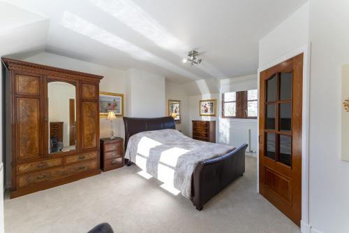Postel nebo postele na pokoji v ubytování Melville Lodge