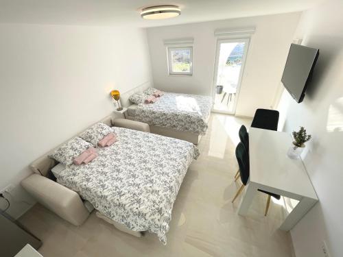 A bed or beds in a room at Apartment Vila **