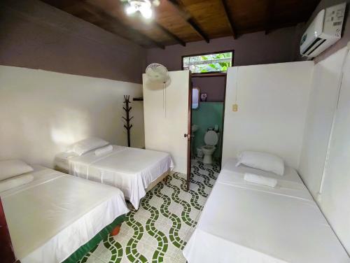 En eller flere senge i et værelse på Casa Del Merman at GayMontanita House