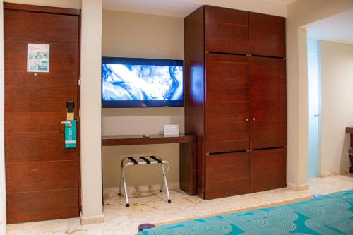 TV a/nebo společenská místnost v ubytování Hotel The Palm