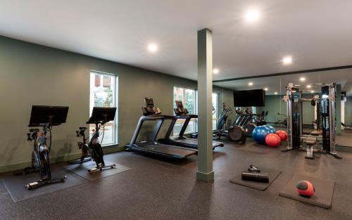 a gym with several treadmills and exercise machines at Kissel Uptown Oakland, in the Unbound Collection by Hyatt in Oakland