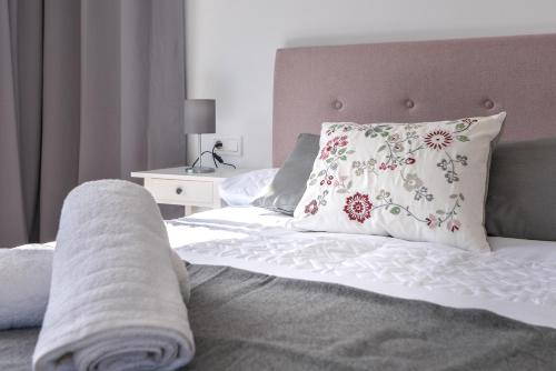 a bedroom with a bed with a pillow on it at LXR Bellavista 3Hab. Next to Sea in Fuengirola