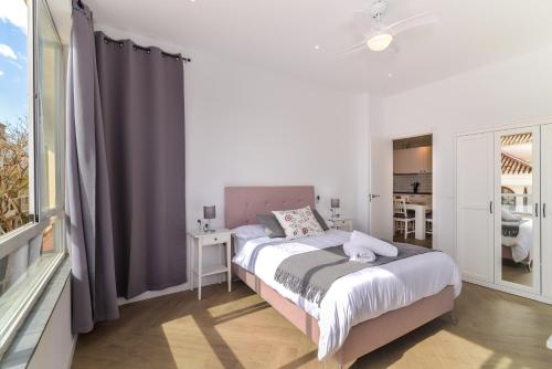 a bedroom with a bed and a large window at LXR Bellavista 3Hab. Next to Sea in Fuengirola