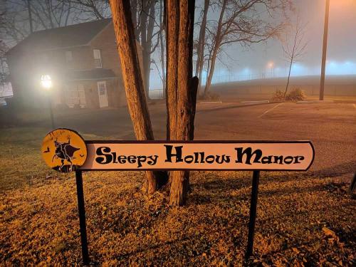 a sign for a sleepyheny hallows marker in front of a house at Sleepy Hollow Manor in Gettysburg