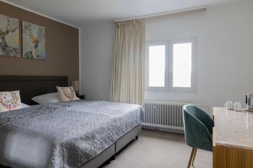 a bedroom with a bed and a window at Bergische Schweiz in Engelskirchen