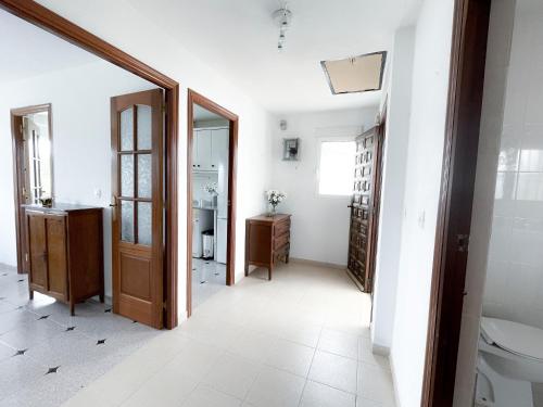 a bathroom with a toilet and a sink at La Zenia Beach House in Alicante