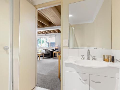 a bathroom with a sink and a mirror at Pinot in Dinner Plain