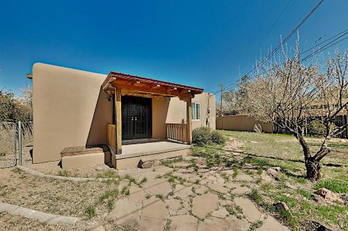 a small building with a gate in a yard at Kathryn Place Casita in Santa Fe