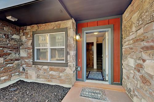 a stone house with a door and a window at Nevis at Newpark Unit 4 in Park City