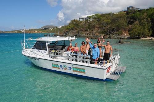 a group of people on a boat in the water at Secret Harbour Beach Resort in St Thomas