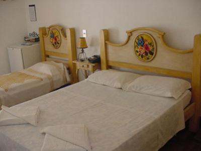 two beds in a room with two bedsskirts at Pouso das Gerais in Tiradentes