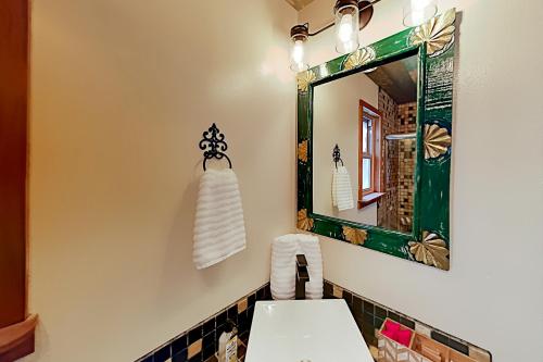 a bathroom with a white toilet and a mirror at Mountain Escape in Taos Ski Valley