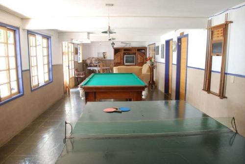 a living room with a pool table in it at Pouso das Gerais in Tiradentes