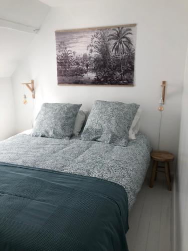 Łóżko lub łóżka w pokoju w obiekcie Gîte Graziella