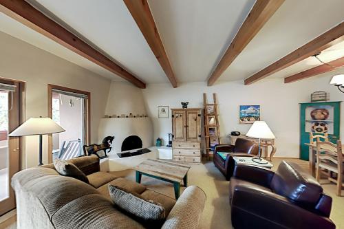 a living room with a couch and a table at Ciclo Grande 202B in Santa Fe