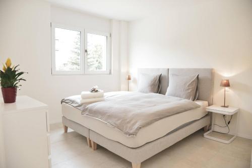 Brand New Apartmentcecilia Residence Apt N1 tesisinde bir odada yatak veya yataklar