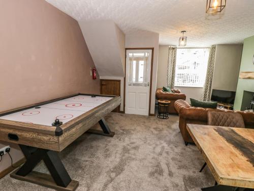 a living room with a pool table in it at TurTwig Cottage in Blaenau-Ffestiniog