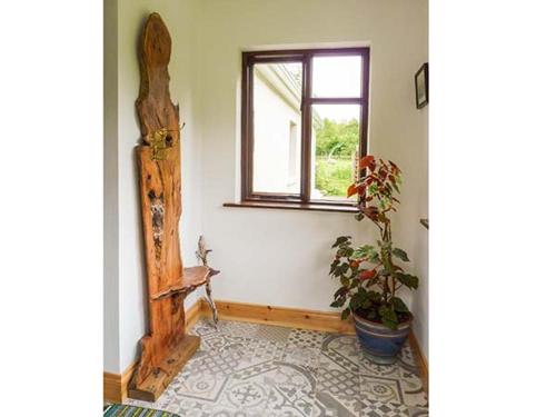 a room with a window and a potted plant at Hawthorn Farm Cottage in Curry